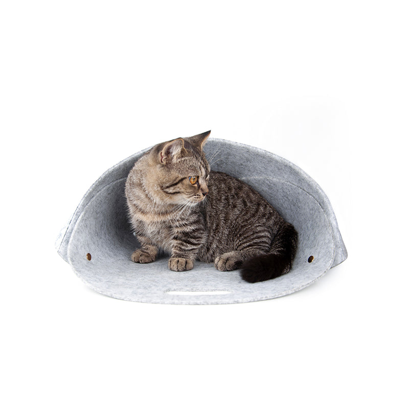 Cat resting inside Pica foldable felt pet nest