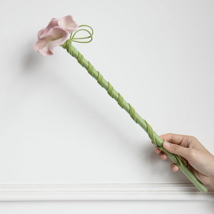 CheerMoe Camellia cat wand with a pink wool flower, green stem and suede cords