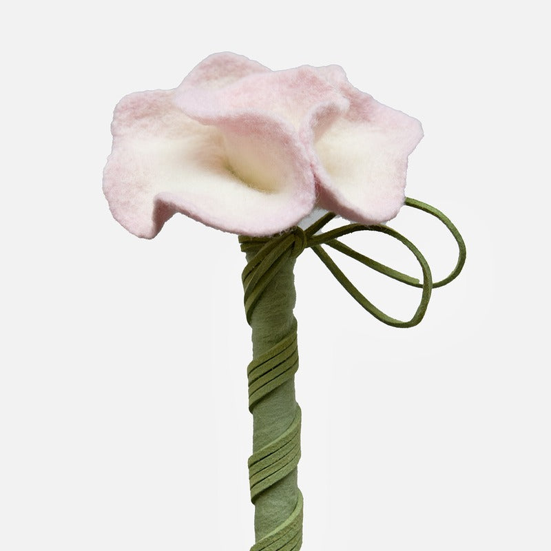 Close-up of the handmade pink wool camellia flower
