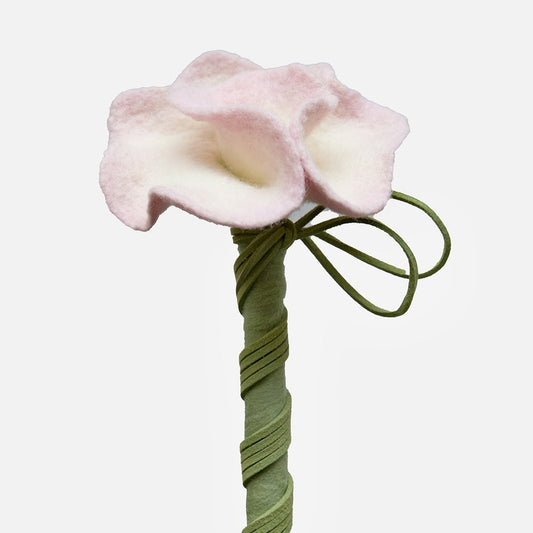 Close-up of the handmade pink wool camellia flower