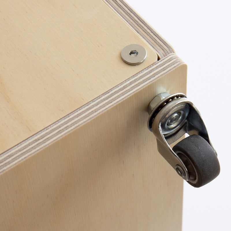 Close-up of a caster wheel and corner fitting on the Haven Cat House Stool