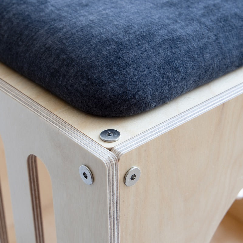 Close-up of the dark seat cushion on the Haven Cat House Stool