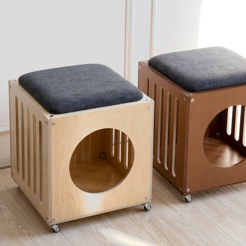 Front view of natural and walnut-finish Haven Cat House Stools on caster wheels