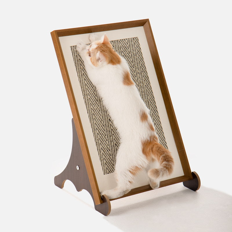 Orange and white cat stretching on the freestanding framed sisal scratcher