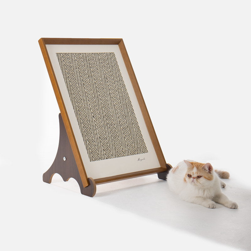 Gallery framed sisal scratcher beside an orange and white cat