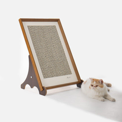 Gallery framed sisal scratcher beside an orange and white cat