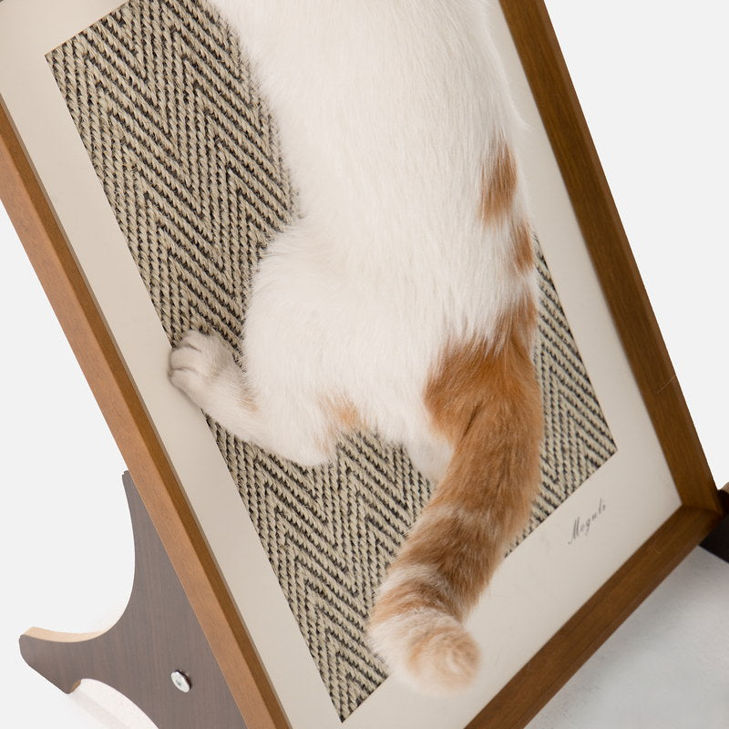 Orange and white cat scratching the herringbone sisal surface