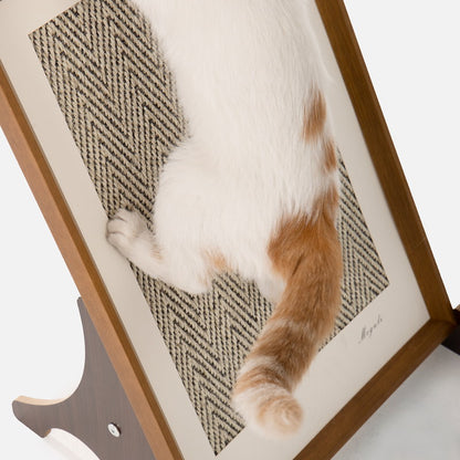 Orange and white cat scratching the herringbone sisal surface