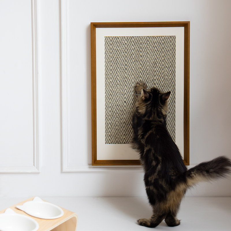Tabby cat scratching the wall-mounted Gallery sisal scratcher
