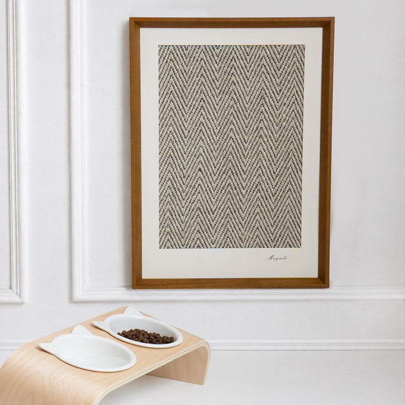 Gallery framed sisal cat scratcher mounted above a modern pet feeder