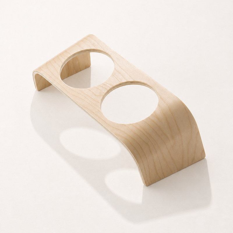 Curved laminated plywood stand with two bowl openings